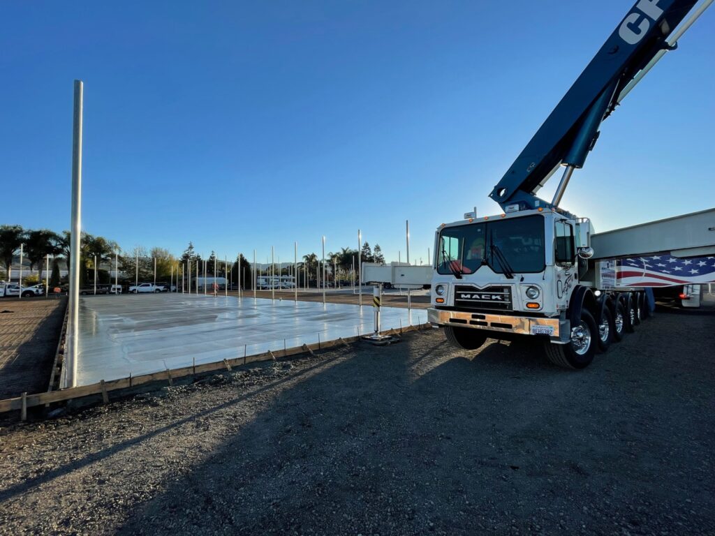 Large commercial concrete slab with a Mack concrete pump truck, South Bay Area