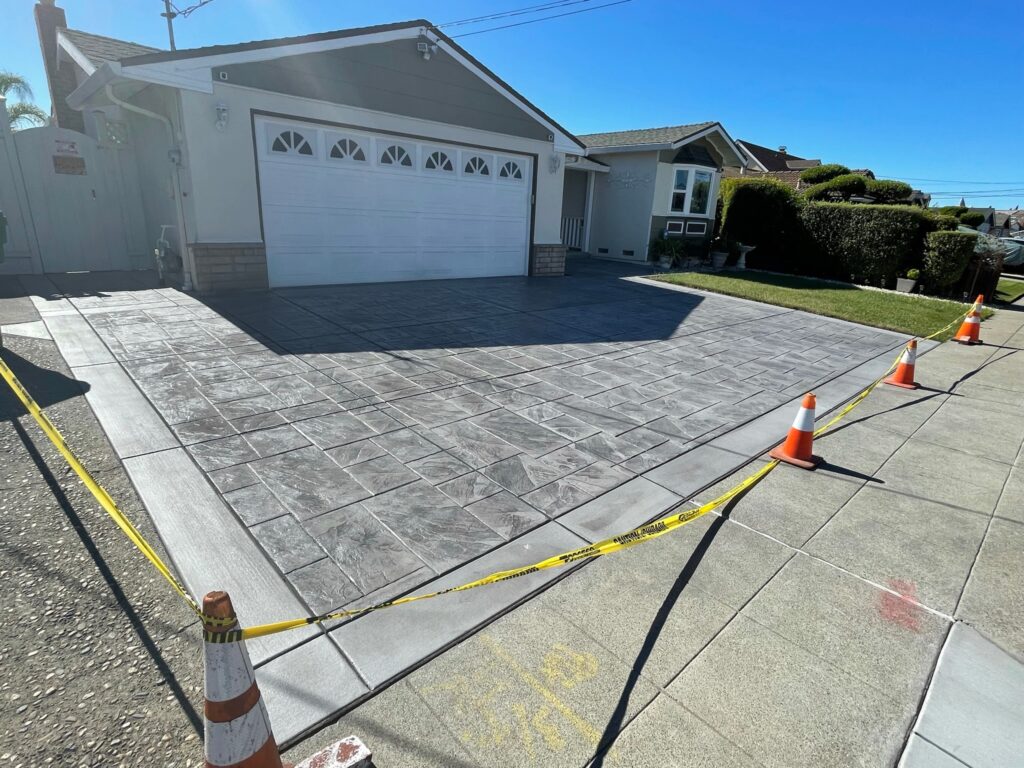 Gray slate stamped concrete driveway with dark border, San Jose CA