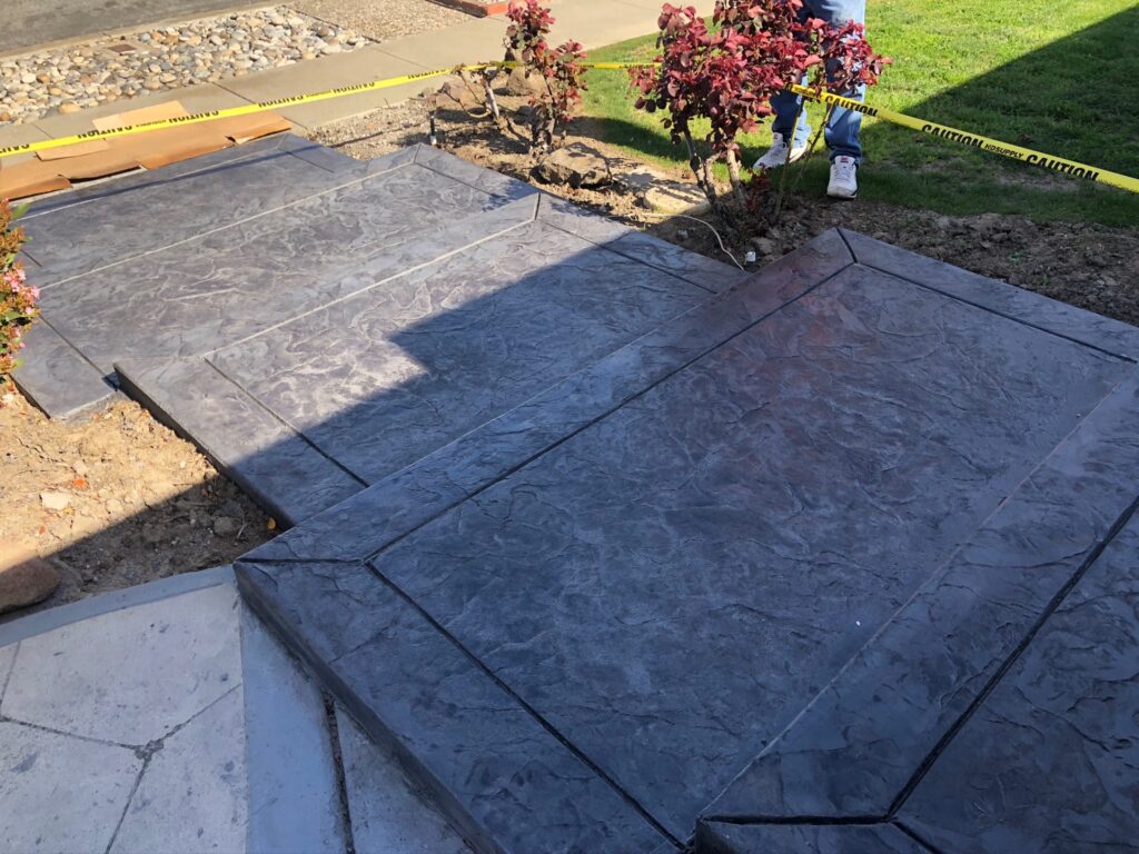 Charcoal slate stamped concrete walkway with steps and borders, San Jose CA